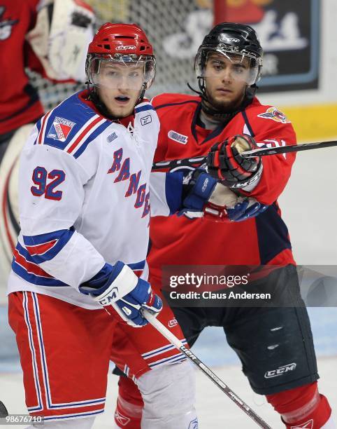 Mark Cundari of the Windsor Spitfires holds Gabriel Landeskog of the Kitchener Rangers in check in the 5th game of the Western Conference Final on...