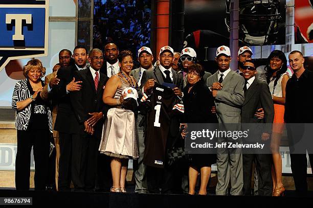 Joe Haden from the Florida Gators holds up a Cleveland Browns jerseyas he poses with family and friends after he was selected overall by the Browns...
