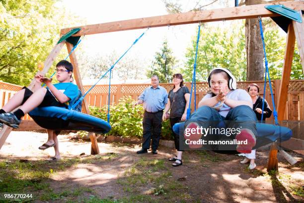 Family with their Autistic and Down Syndrome Twins brother and sister in daily lives