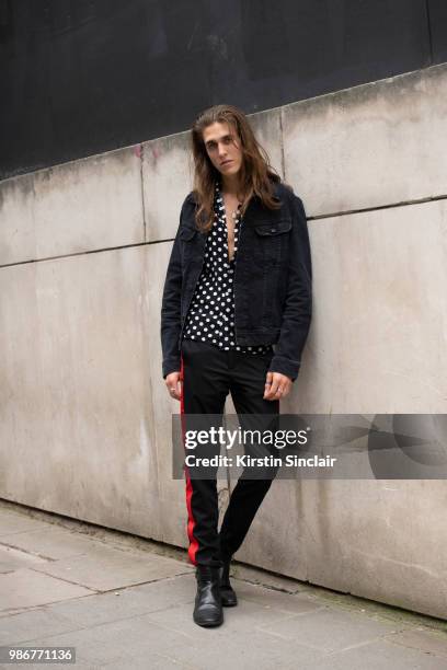 Musician Harry Morris from the Shantics wears Zara trousers, Lee jacket, vintage shirt and River Island shoes during London Fashion Week Men's on...