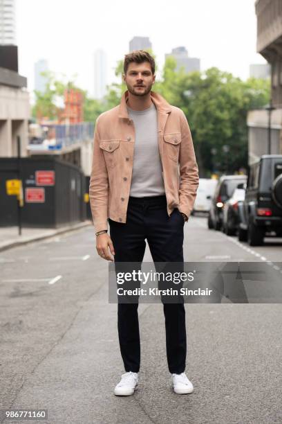 Digital Influencer and Vlogger Jim Chapman wears a Dunhill jacket, Reiss T shirt, Burberry trousers, Adidas trainers during London Fashion Week Men's...