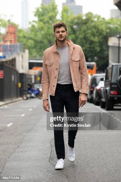 Digital Influencer and Vlogger Jim Chapman wears a Dunhill jacket, Reiss T shirt, Burberry trousers, Adidas trainers during London Fashion Week Men's...