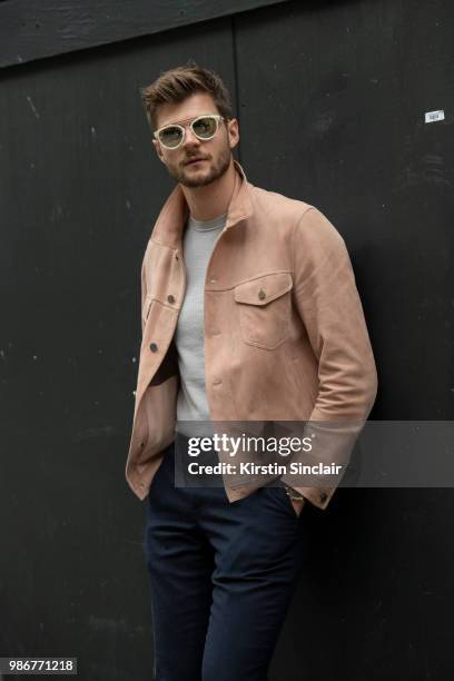 Digital Influencer and Vlogger Jim Chapman wears a Dunhill jacket, Reiss T shirt, Burberry trousers, Taylor Morris sunglasses during London Fashion...