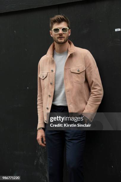 Digital Influencer and Vlogger Jim Chapman wears a Dunhill jacket, Reiss T shirt, Burberry trousers, Taylor Morris sunglasses during London Fashion...