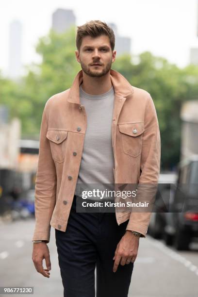 Digital Influencer and Vlogger Jim Chapman wears a Dunhill jacket, Reiss T shirt, Burberry trousers, Taylor Morris sunglasses during London Fashion...