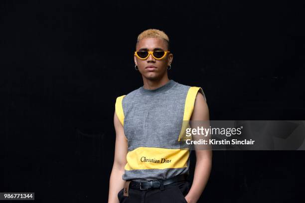 Model and Stylist Jordan Archer wears Christian Dior top, Dolce and Gabbana jeans during London Fashion Week Men's on June 9, 2018 in London, England.
