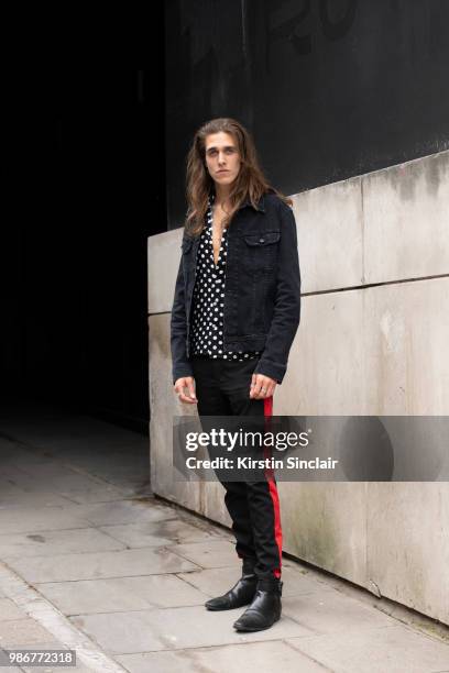 Musician Harry Morris from the Shantics wears Zara trousers, Lee jacket, vintage shirt and River Island shoes during London Fashion Week Men's on...
