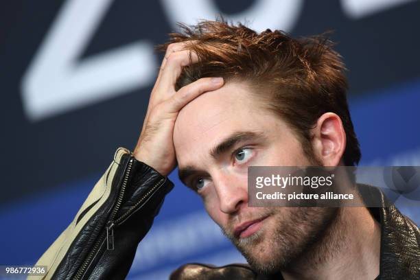 British actor Robert Pattinson reacts during a press conference for the film 'Damsel' during the 68th International Berlin Film Festival, in Berlin,...