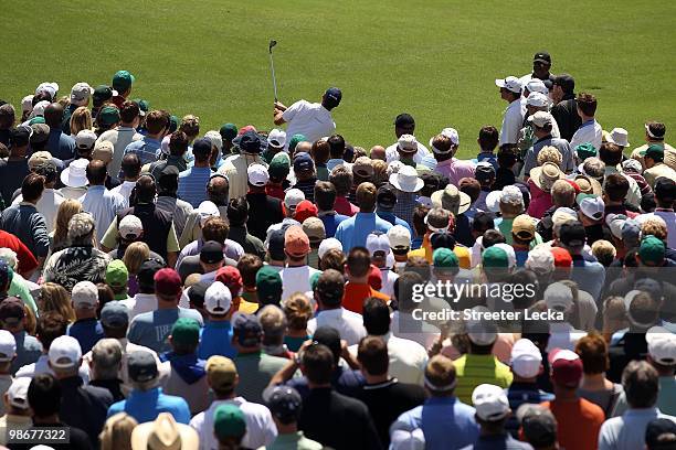 Fans crowd around Matt Kuchar as he hits his shot on the 11th hole during the second round of the 2010 Masters Tournament at Augusta National Golf...