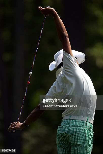 Shingo Katayama stretches during the second round of the 2010 Masters Tournament at Augusta National Golf Club on April 9, 2010 in Augusta, Georgia.