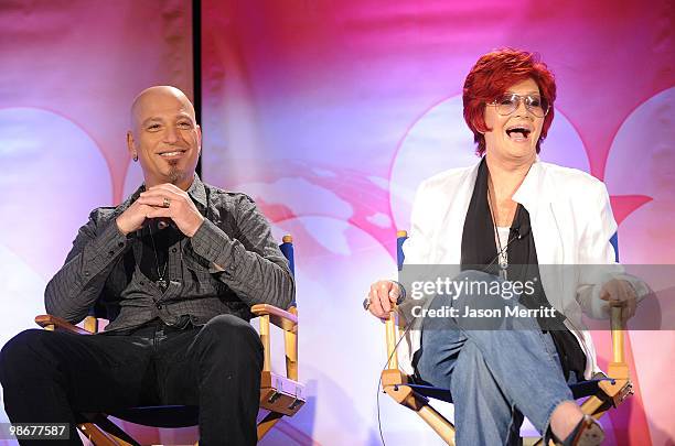 Judges Howie Mandel and Sharon Osbourne talk with reporters at the NBC Universal Summer Press Day on April 26, 2010 in Pasadena, California.