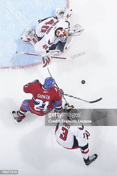 Brian Gionta of Montreal Canadiens takes a shot on goalie Semyon Varlamov of the Washington Capitals in Game Four of the Eastern Conference...