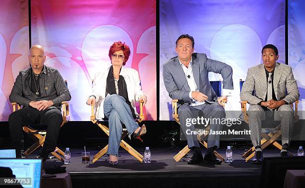 Judge Howie Mandel, judge Sharon Osbourne, judge Piers Morgan, and host Nick Canon talk with reporters at the NBC Universal Summer Press Day on April...