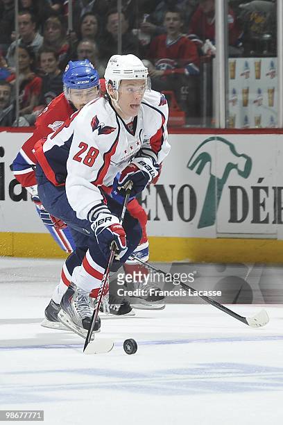 Alexander Semin of the Washington Capitals skates with the puck in front of Tomas Plekanec of Montreal Canadiens in Game Four of the Eastern...