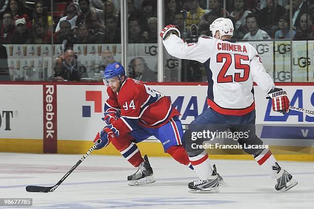 Tom Pyatt of Montreal Canadiens skates withthe puck in front of Jason Chimera of the Washington Capitals in Game Four of the Eastern Conference...