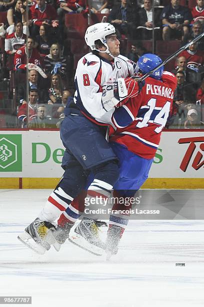 Alex Ovechkin of the Washington Capitals collides with Tomas Plekanec of Montreal Canadiens in Game Four of the Eastern Conference Quarterfinals...