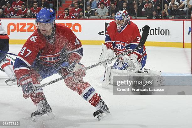 Carey Price of Montreal Canadiens blocs a shot in front of teammate Marc-Andre Bergeron in Game Four of the Eastern Conference Quarterfinals against...