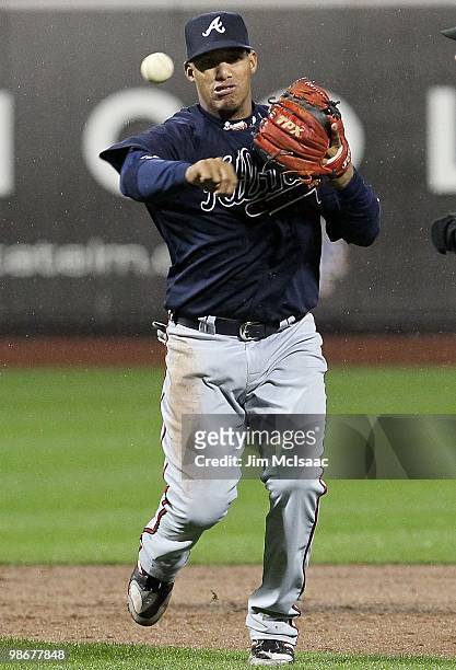 Yunel Escobar of the Atlanta Braves throws to first against the New York Mets on April 25, 2010 at Citi Field in the Flushing neighborhood of the...