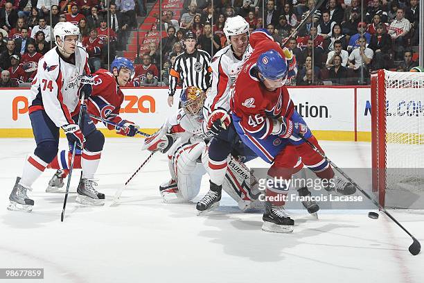 Andrei Kostitsyn of Montreal Canadiens skates with the puck in front of Semyon Varlamov of the Washington Capitals in Game Four of the Eastern...
