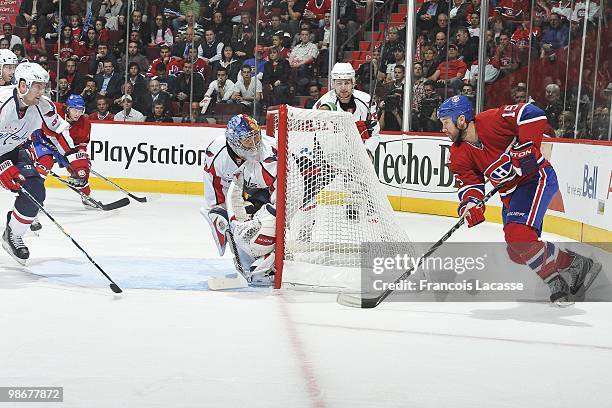 Glen Metropolit of Montreal Canadiens takes as shot on goalie Semyon Varlamov of the Washington Capitals in Game Four of the Eastern Conference...