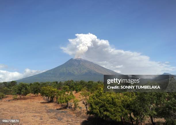Mount Agung volcano erupts in the Kubu sub-district in Karangasem Regency on Indonesia's resort island of Bali on June 29, 2018. - Thousands of...
