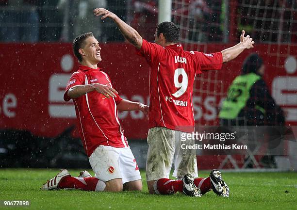 Emil Jula of Cottbus celebrates with team mate Nils Petersen after scoring the fourth goal during the Second Bundesliga match between FC Energie...