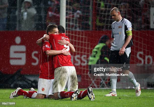 Emil Jula of Cottbus celebrates with team mate Nils Petersen after scoring the fourth goal during the Second Bundesliga match between FC Energie...