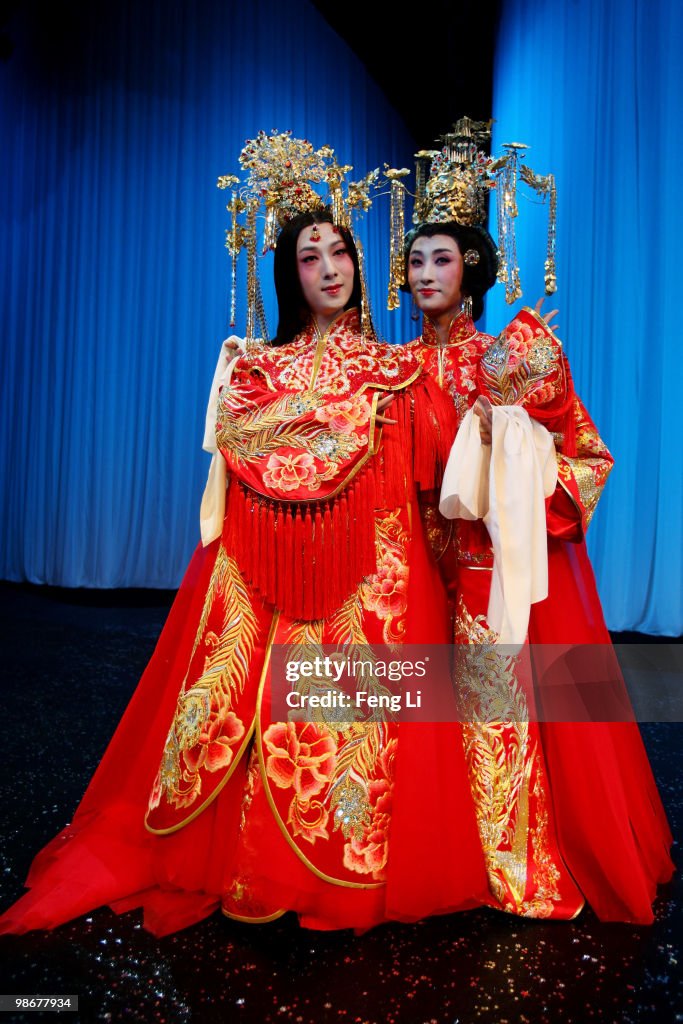Opera Rasmi Two male opera performers, acting in female roles, pose on the runway ...