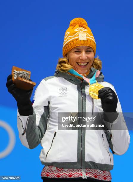 February 2018, South Korea, Pyeongchang, Olympics, Nordic Skiing, biathlon, womens 12,5 km, award ceremony, medal plaza: Anastasiya Kuzmina from...