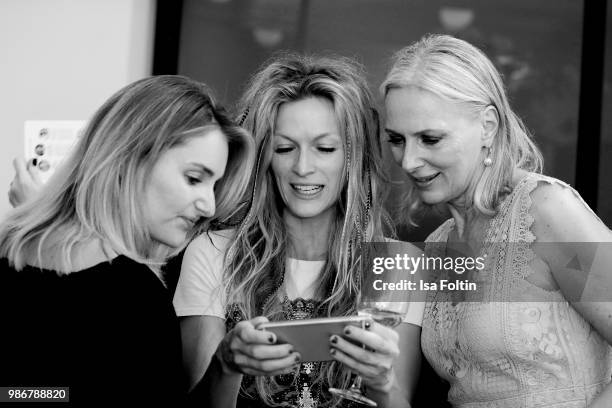 Model and influencer Marie von den Benken, performance artist Mia Florentine Weiss and model Petra van Bremen during the Emotion Award at Curio Haus...