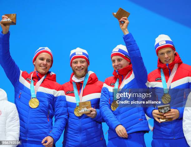 February 2018, South Korea, Pyeongchang, Olympics, Nordic Skiing, mens 4x10 km relay, award ceremony, medal plaza: Didrik Toenseth , Martin Johnsrud...