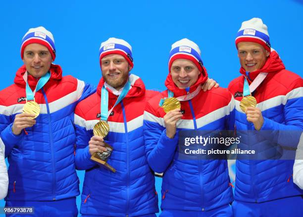 February 2018, South Korea, Pyeongchang, Olympics, Nordic Skiing, mens 4x10 km relay, award ceremony, medal plaza: Didrik Toenseth , Martin Johnsrud...