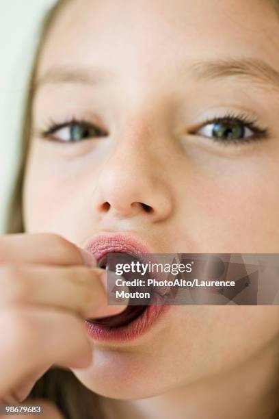 girl eating cherry, close-up - bing cherry stock pictures, royalty-free photos & images