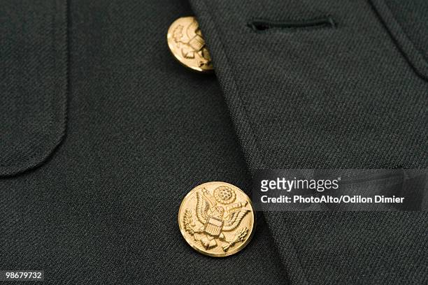 brass buttons of military dress uniform jacket - boutonniere ストックフォトと画像