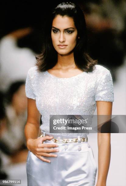 Yasmeen Ghauri models Valentino at New York Fashion Week circa 1994 in New York.