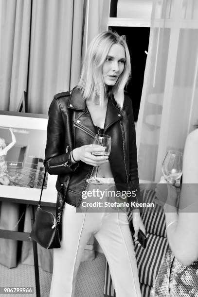 Guest attends Diesel Presents Scott Lipps Photography Exhibition 'Rocks Not Dead' at Sunset Tower on June 28, 2018 in Los Angeles, California.