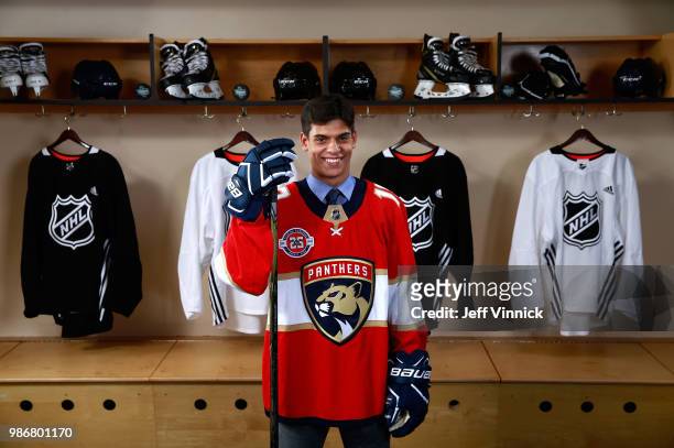Grigori Denisenko poses for a portrait after being selected fifteenth overall by the Florida Panthers during the first round of the 2018 NHL Draft at...