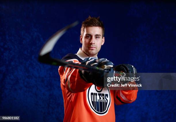 Evan Bouchard poses for a portrait after being selected tenth overall by the Edmonton Oilers during the first round of the 2018 NHL Draft at American...