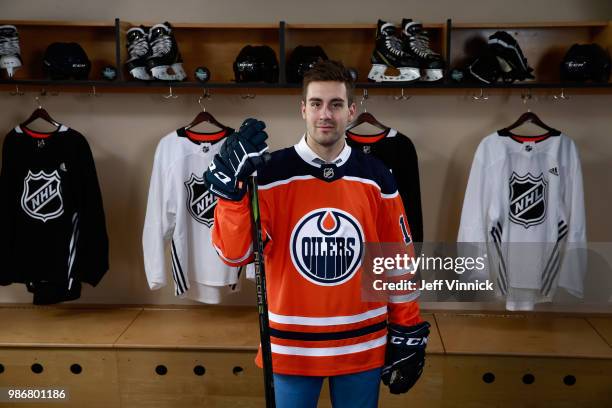 Evan Bouchard poses for a portrait after being selected tenth overall by the Edmonton Oilers during the first round of the 2018 NHL Draft at American...