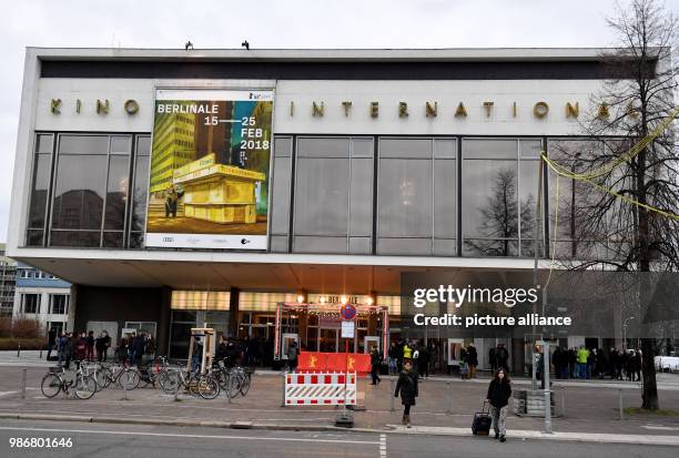 February 2018, Germany, Berlin: Berlinale, Premiere, "Shut Up and Play the Piano". Visitors standing in front of the Kino International. The film is...