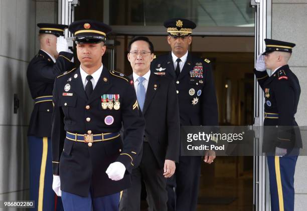 South Korean Defense Minister Song Young-moo, front center, and U.S. Gen. Vincent Brooks, front top, commander of the United Nations Command, U.S....