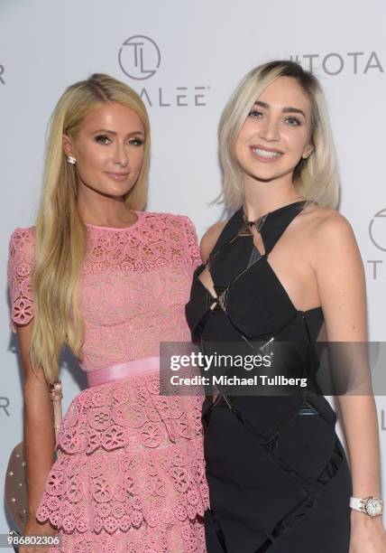 Paris Hilton and Megan Pormer attend the launch of stylist Lee Rittiner's TOTALEE hair care system and atelier at TOTALEE on the ALLEY Beverly Hills...