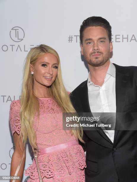 Paris Hilton and stylist Lee Rittiner attend the launch of Rittiner's TOTALEE hair care system and atelier at TOTALEE on the ALLEY Beverly Hills on...