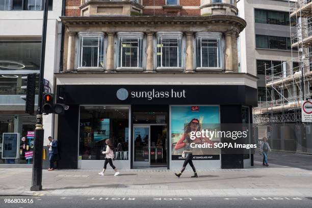 Sunglass hut in London. London is the Capital city of England and the United Kingdom, it is located in the south east of the country, in 2017 it is...