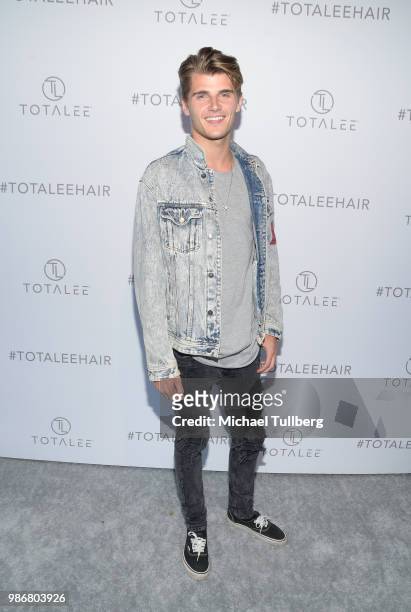 Twan Kuyper attends the launch of stylist Lee Rittiner's TOTALEE hair care system and atelier at TOTALEE on the ALLEY Beverly Hills on June 28, 2018...