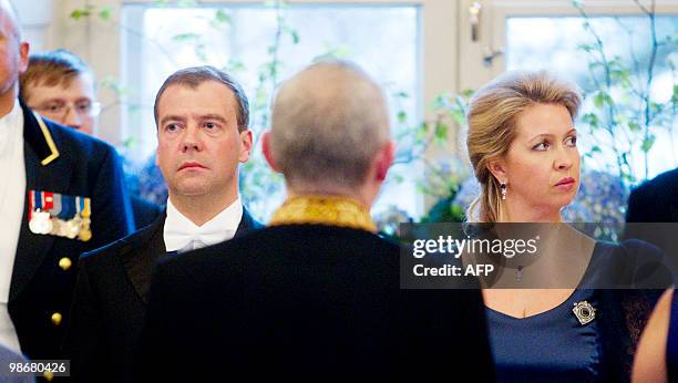 Russian president Dmitry Medvedev and his wife Svetlana attend a gala dinner at the Royal Palace in Oslo on April 26, 2010. Russian President Dmitry...