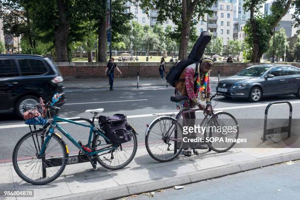 Cyclist locking up his bike. London is the Capital city of England and the United Kingdom, it is located in the south east of the country. In 2017 it...