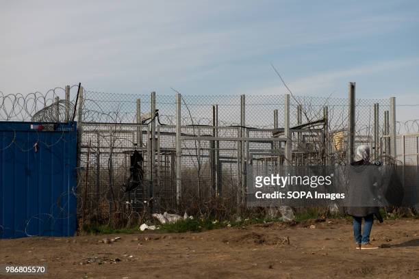 Syrian mother holds her baby next to the gate separating Serbia and Hungary as they applied for asylum at the Kelebija border crossing point. Hungary...