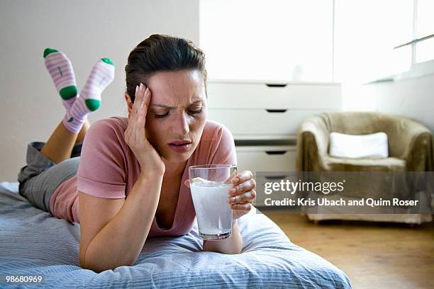 woman at home - hangover headache stock pictures, royalty-free photos & images