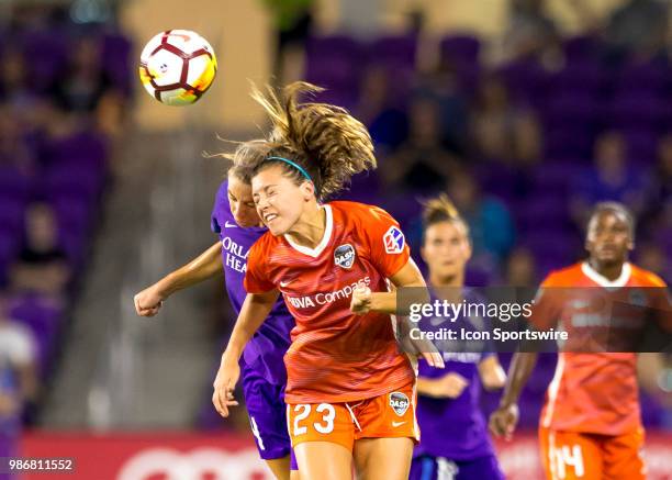 Houston Dash defender Sofia Huerta heads the ball away from Orlando Pride defender Alanna Kennedy during the NWSL soccer match between the Orlando...